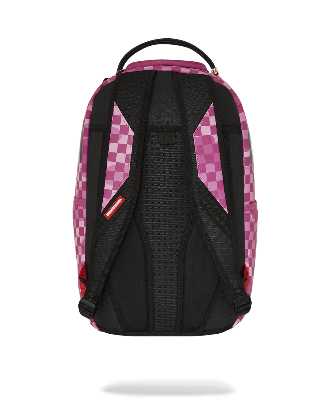 Black leather backpack for men displayed on a modern workspace desk