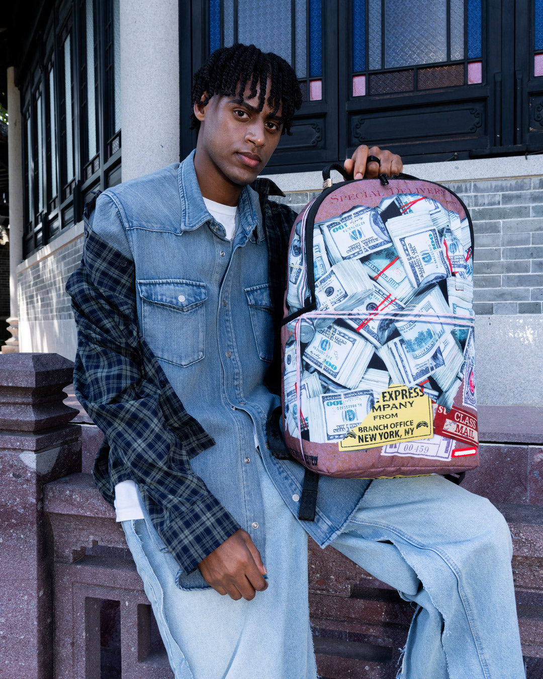 Front view of the Weekend Voyager Laptop Backpack showcasing its sleek design.