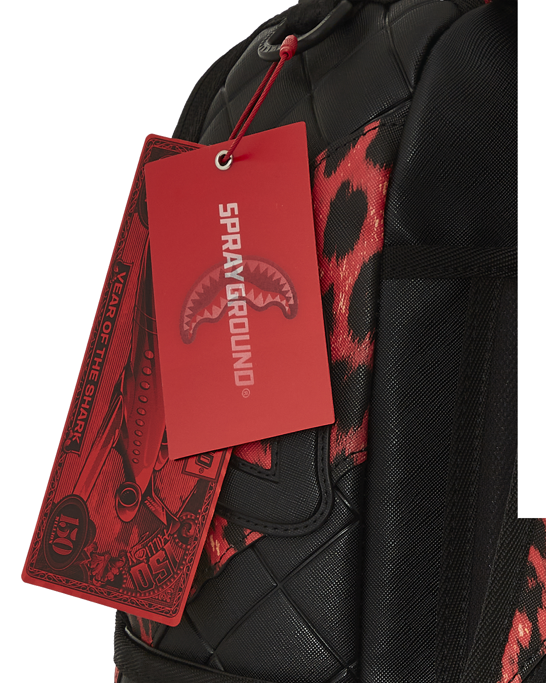Front view of quilted backpack with leopard print and sharkmouth motif