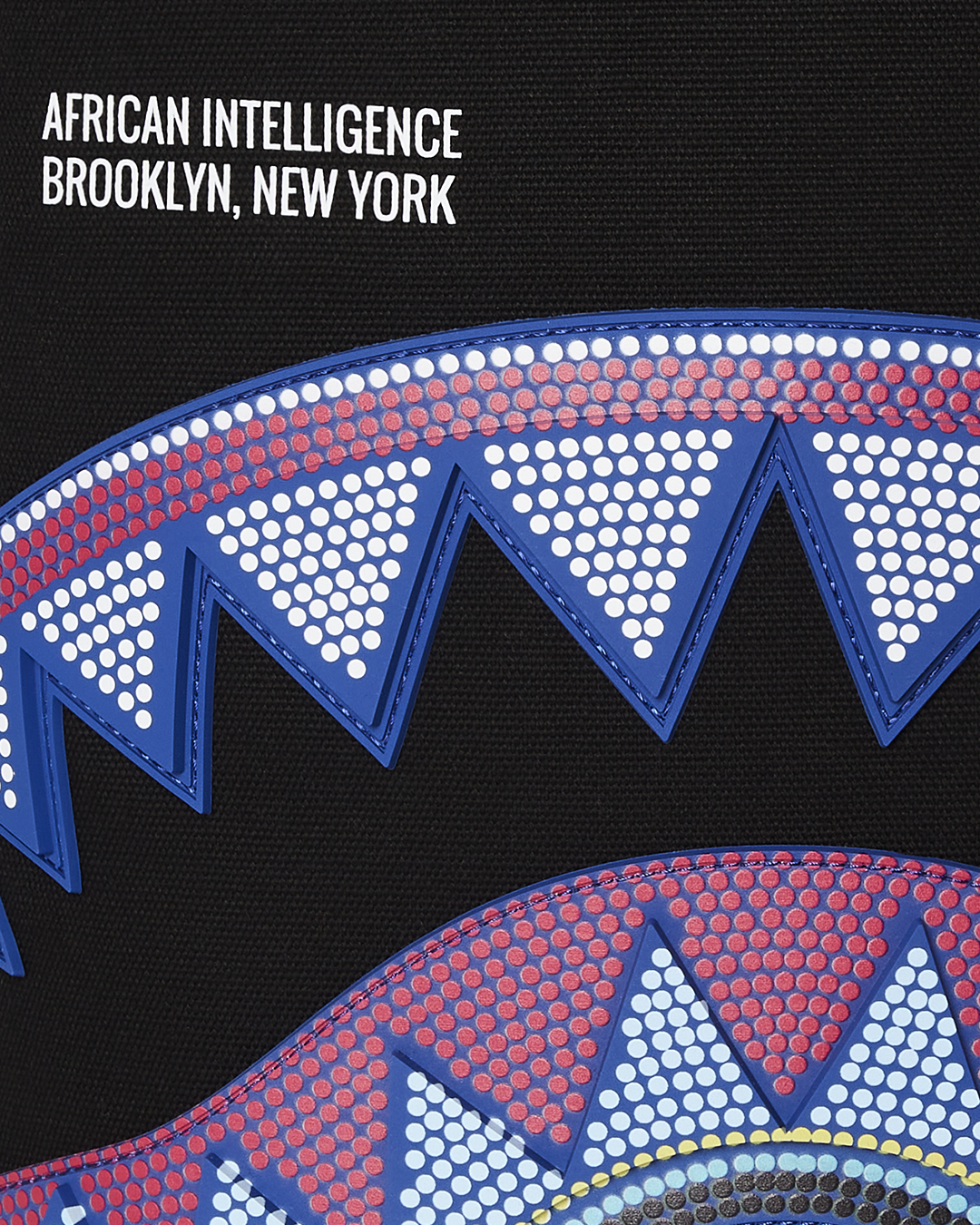 Side pocket detail showing Sprayground’s signature zipper design