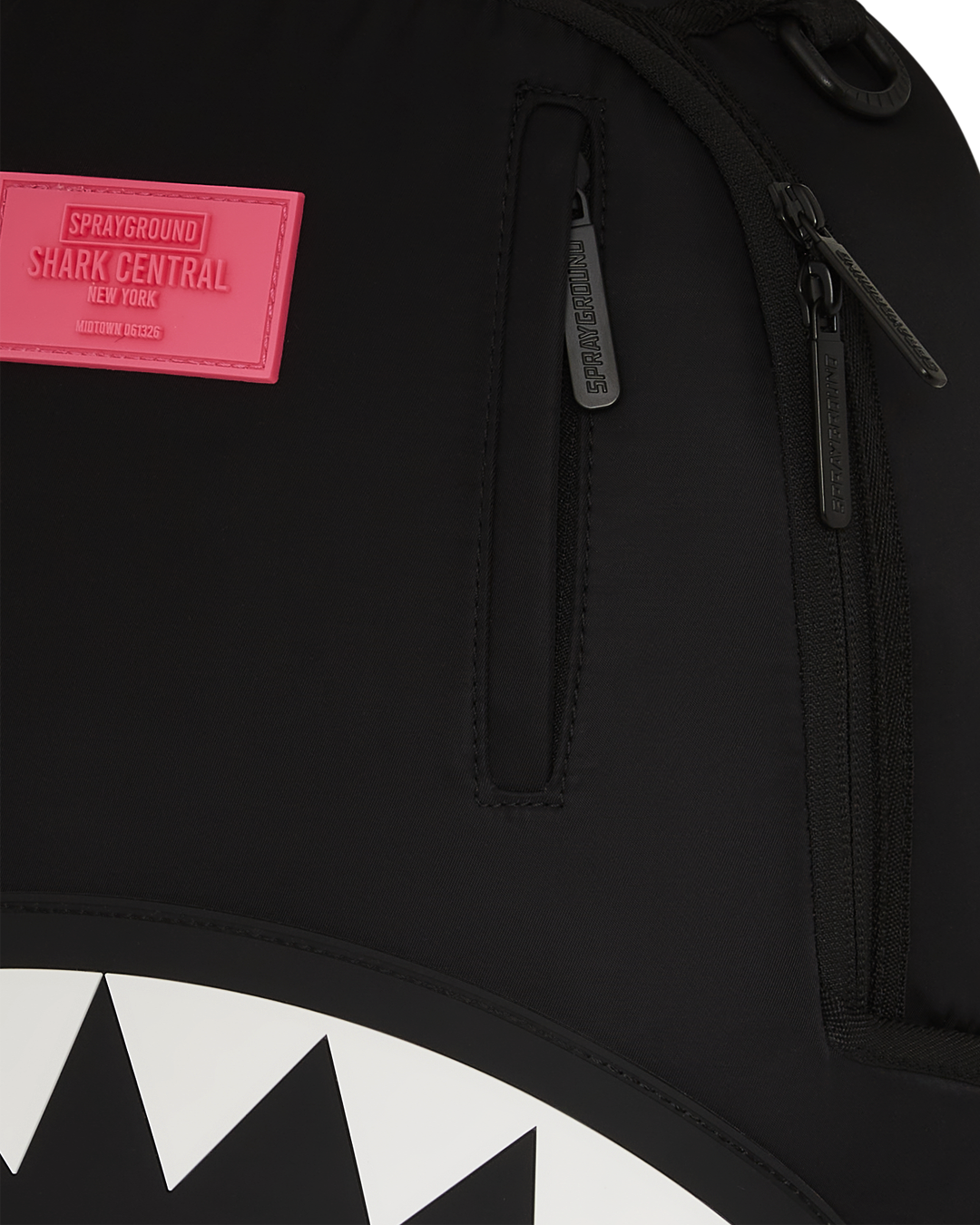 Sprayground Shark backpack with neon venom design, front view