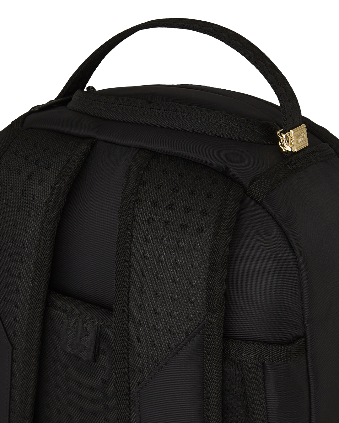 Sprayground Shark Mouth Neon Venom Backpack being used for travel, connected to a carry-on luggage