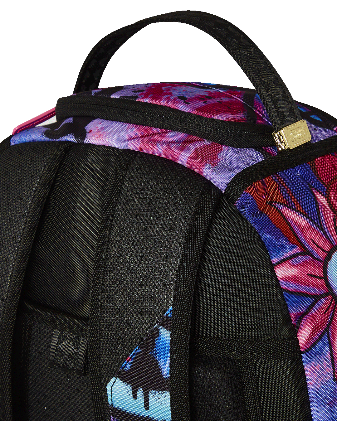 Front view of Sprayground backpack showing gold zippers and designer badge
