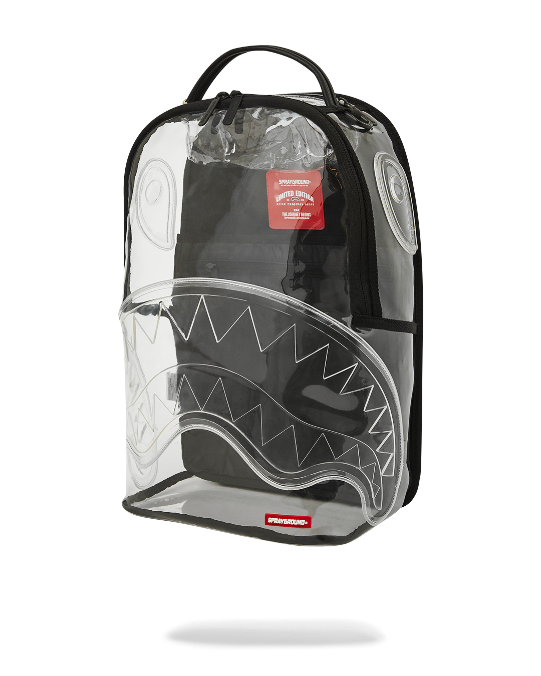 Front view of the clear sprayground backpack with shark design and removable bear accessory