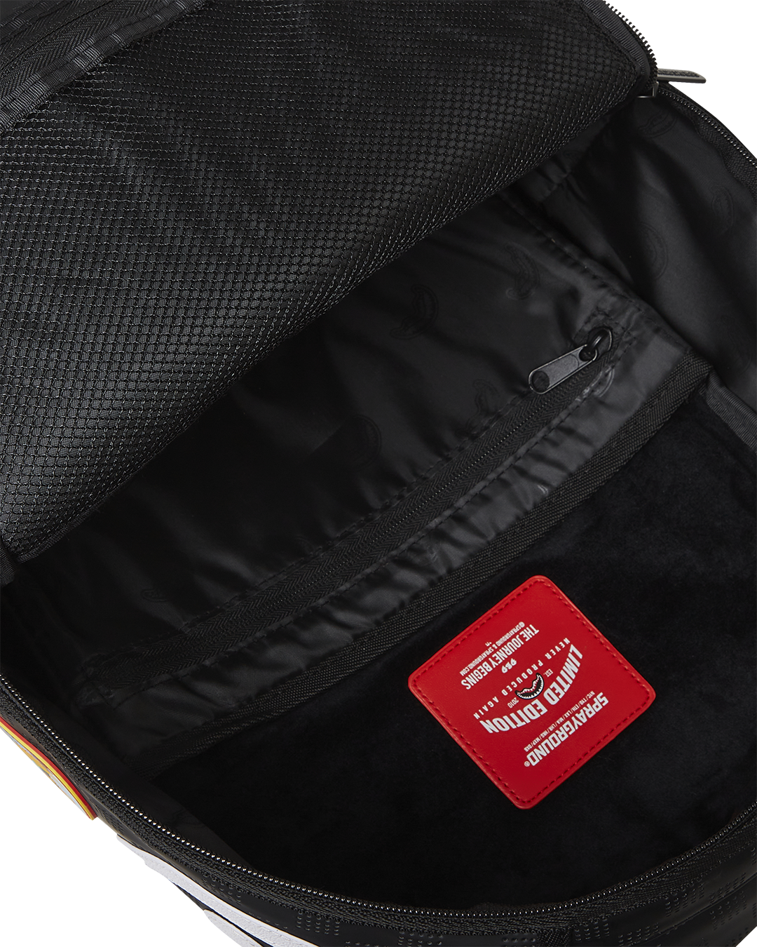 Close-up of faux leather texture and gold hardware on luxury backpack