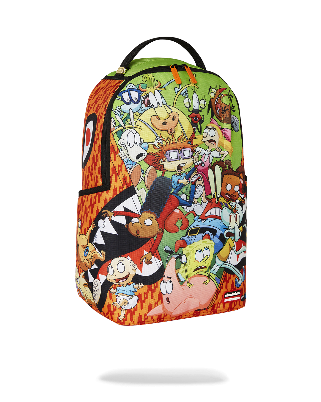 Side angle of the kids travel backpack placed beside a carry-on luggage piece.