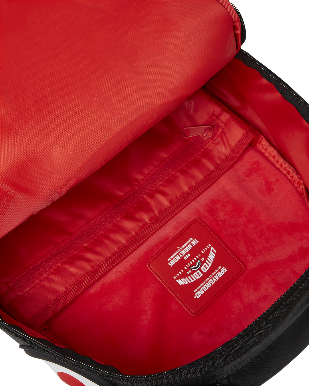 Front view of clear backpack with shark bite design and gold zippers