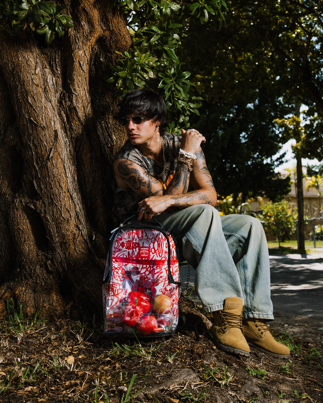 Sprayground Clear Diablo Gallery backpack with multiple compartments, side view.