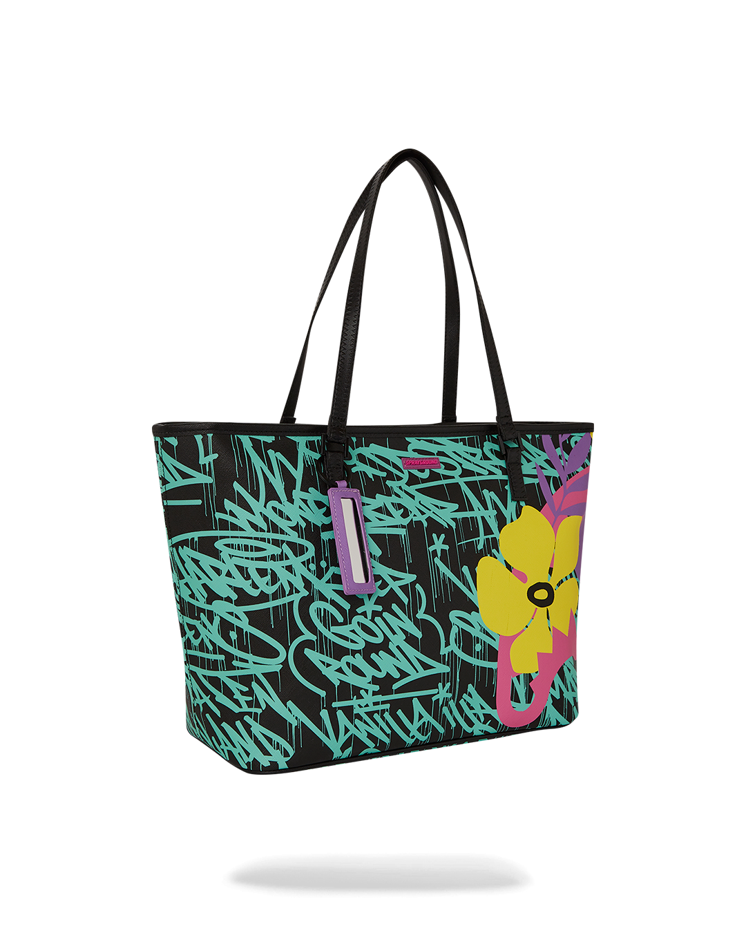 Model carrying the designer tote crossbody style with urban backdrop