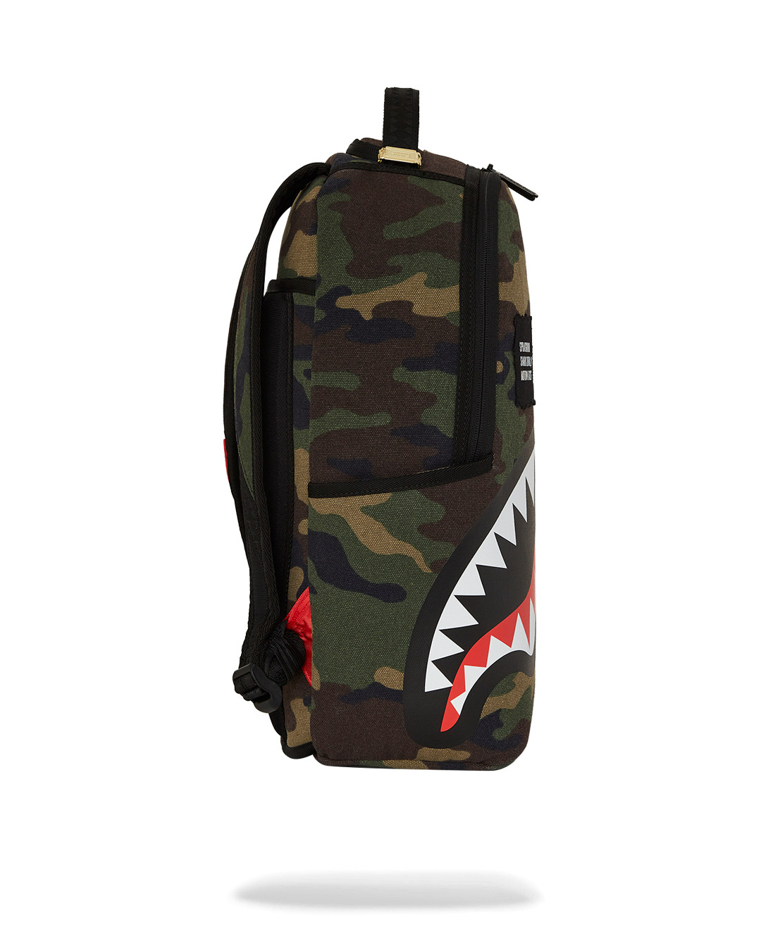 Backpack with laptop compartment open, showing velour lining and mesh pockets.