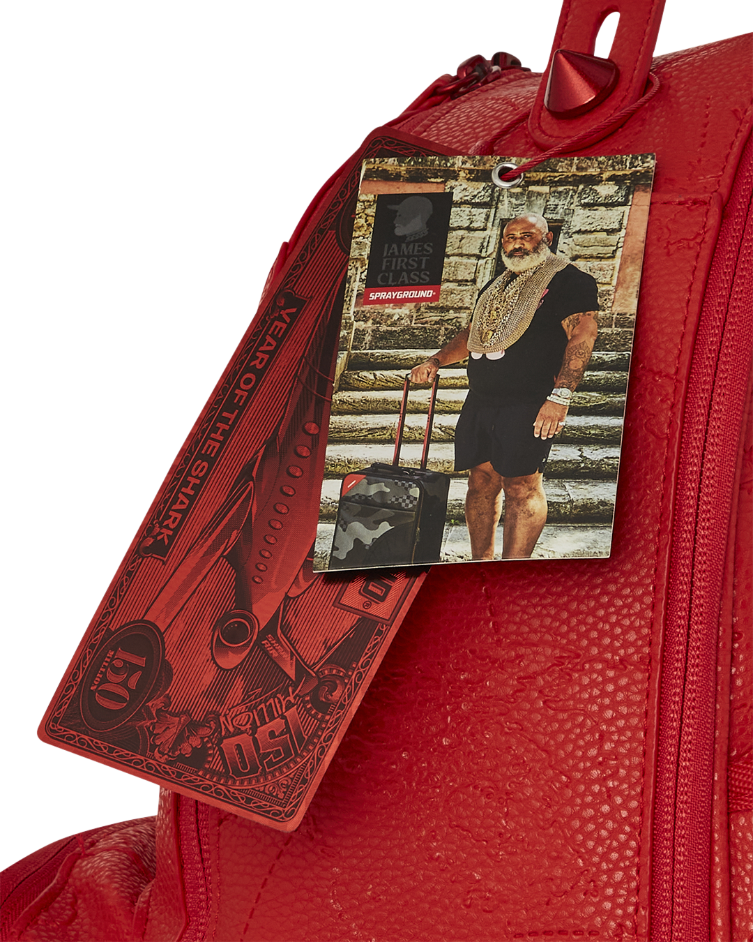 Front view of the ruby red vegan leather backpack with metal zippers