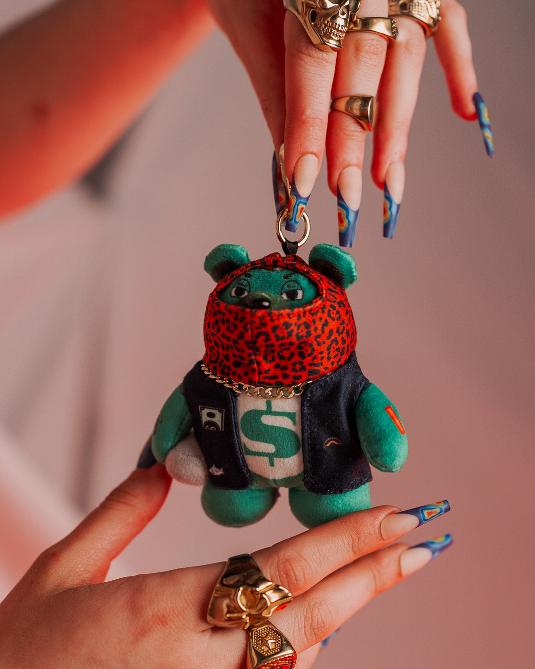 Side view of Ski Mask Bear keychain showcasing its plush texture.
