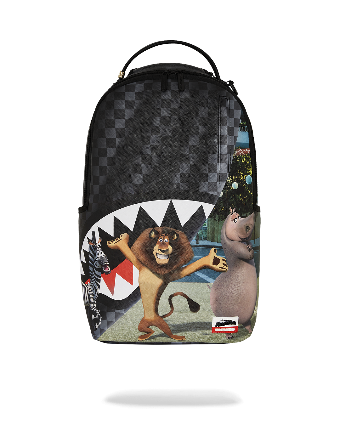 Madagascar Escape Backpack shown in use with a laptop and travel essentials