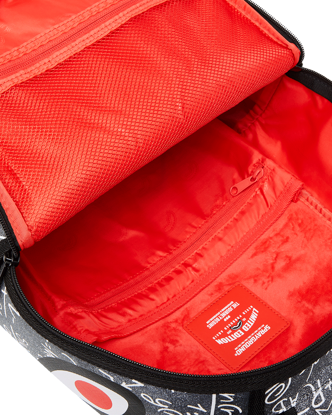 Side view of clear sprayground backpack featuring adjustable straps and gold zippers.