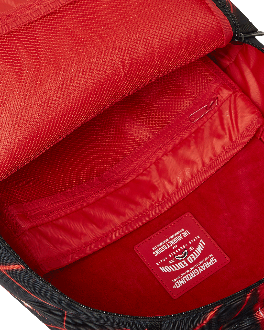 Back view of the Laser Shark Backpack, demonstrating its slide-through back sleeve for connecting to carry-on luggage.