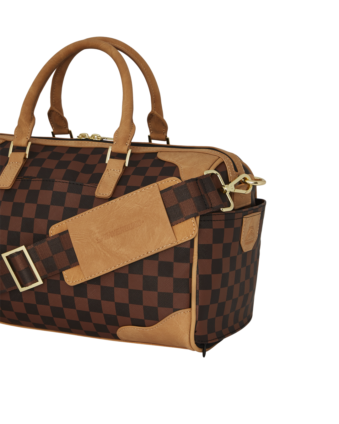 Side angle showing adjustable strap on faux leather bag resting on a table