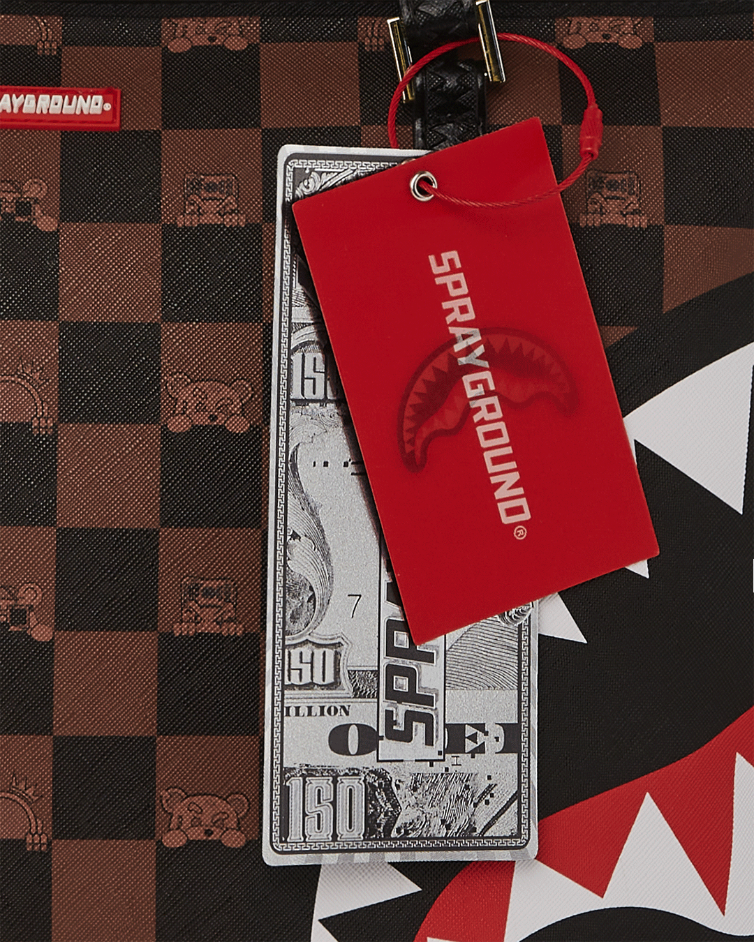 Sprayground faux leather bag with spacious interior pocket shown during use