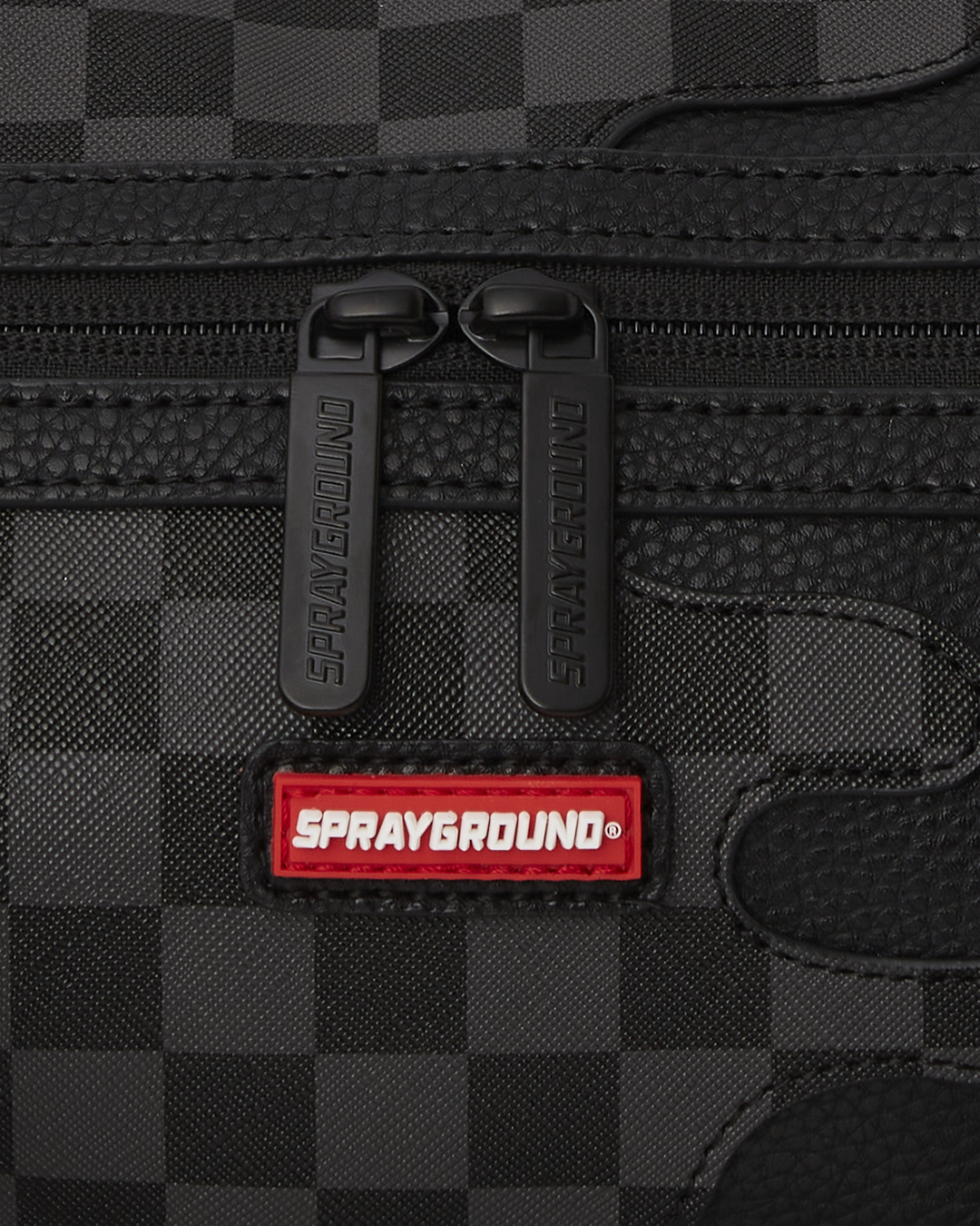 Side view of the mini duffle bag with crossbody strap and interior pockets.