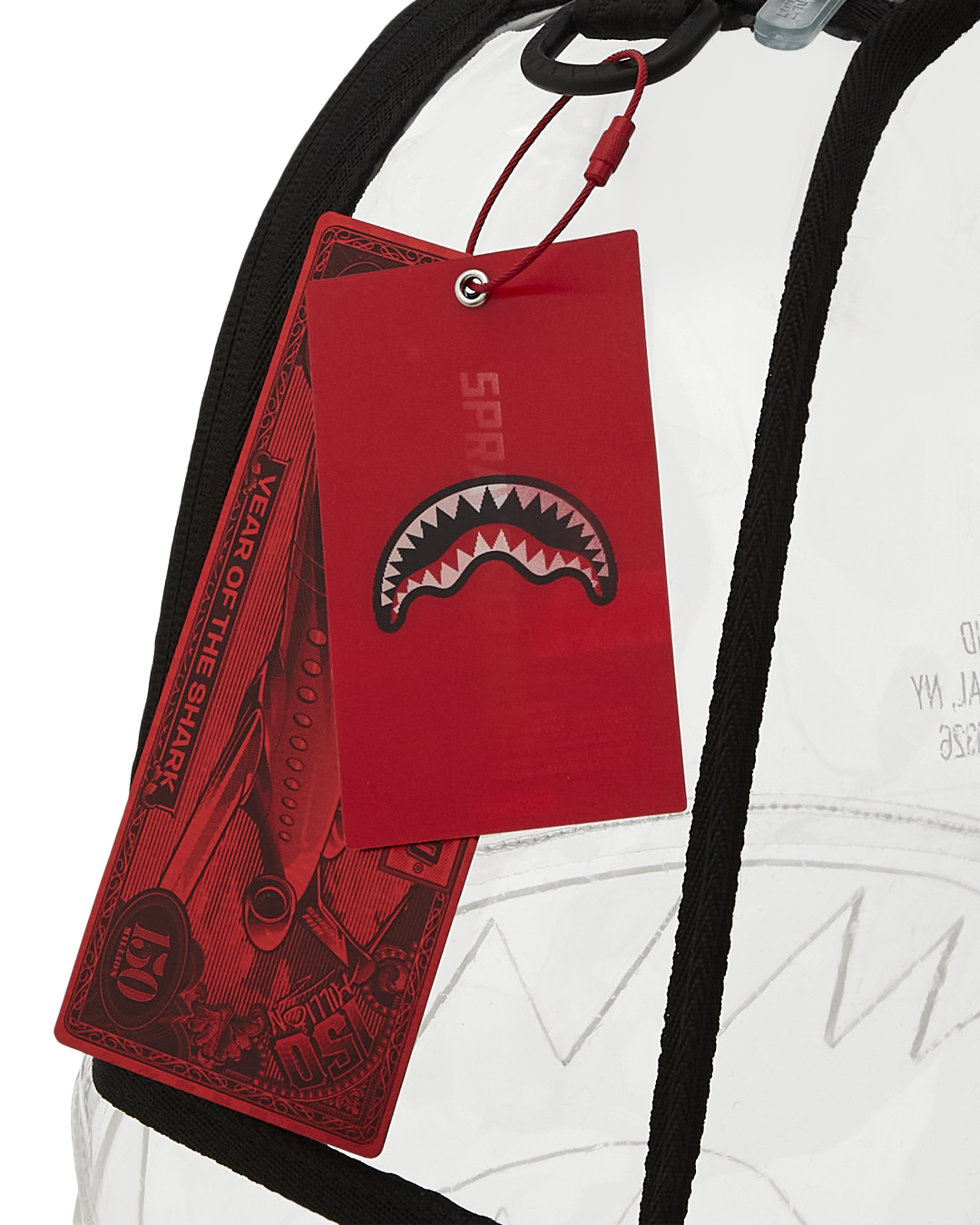 Close-up of the backpacks front zipper pocket and sharkmouth design.