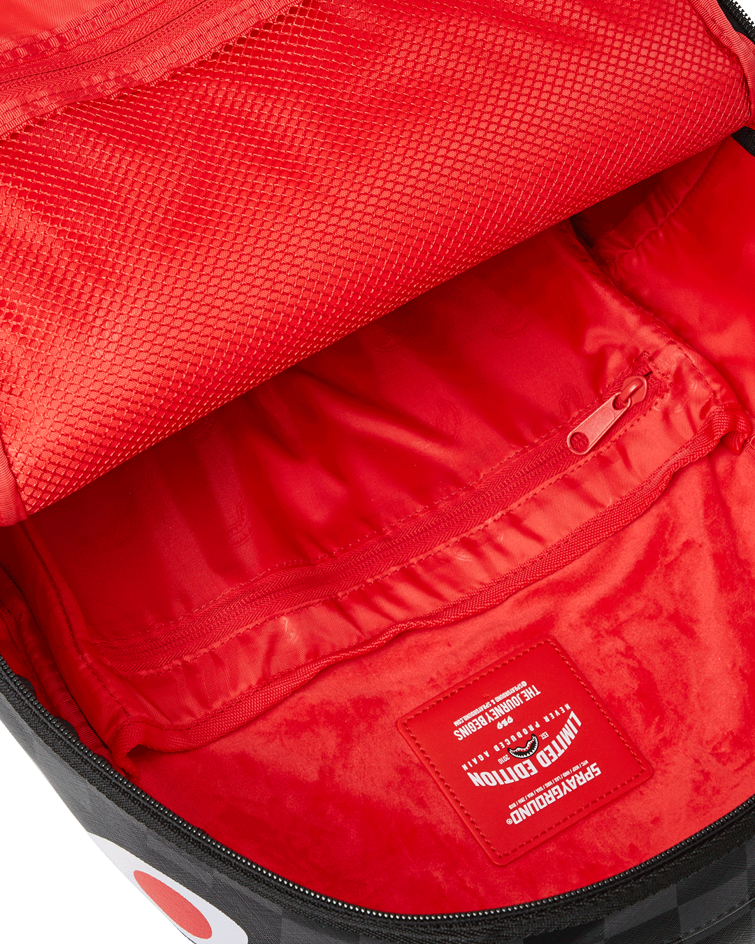 Interior view of the faux leather laptop backpack showcasing the velour laptop compartment.