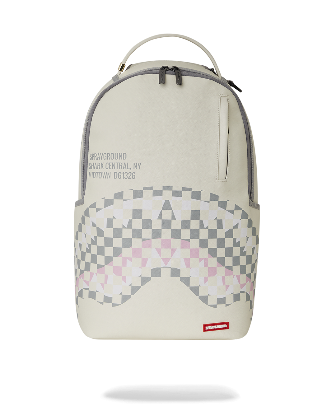 Front view of Sprayground shark mouth backpack with gold zippers.