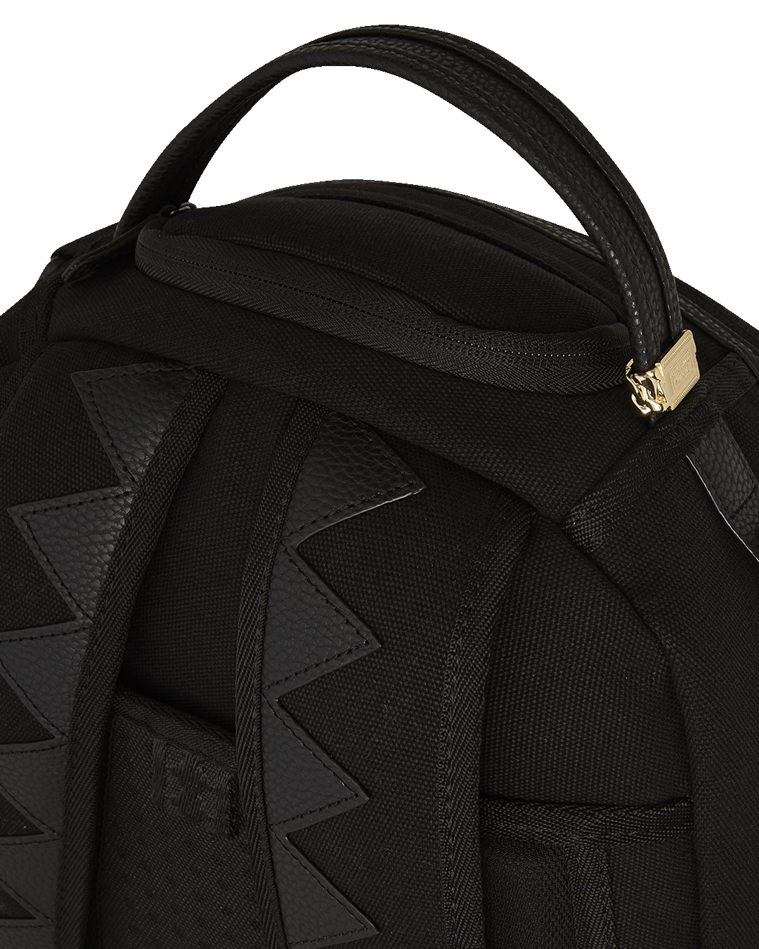 Sprayground Stealth Fang backpack in pink, showcasing its canvas material and PVC details.