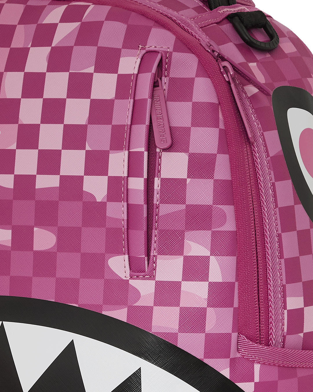 Man wearing the Sprayground leather backpack in a city setting