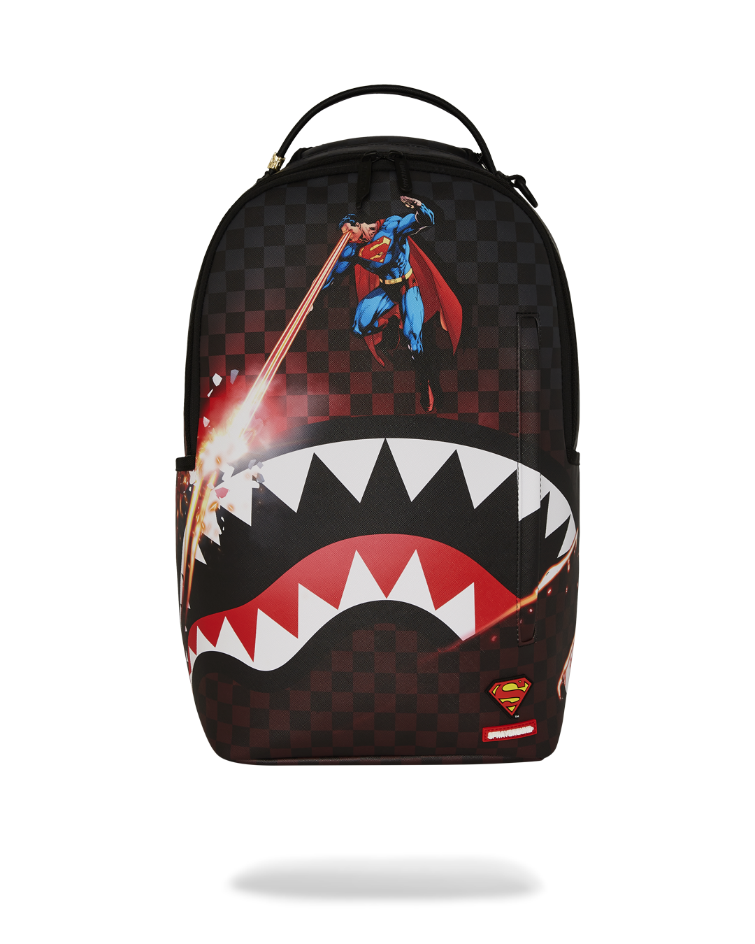 Superman faux leather backpack displayed on a wooden bench, showcasing front pockets.