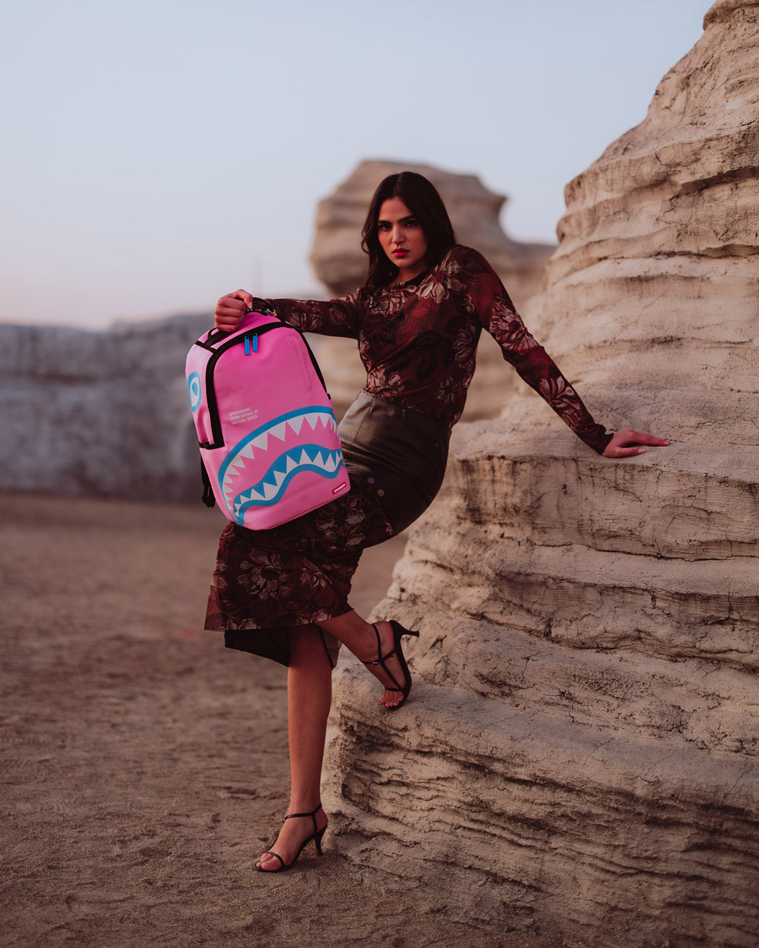 Shark Central faux leather backpack worn over one shoulder in urban setting