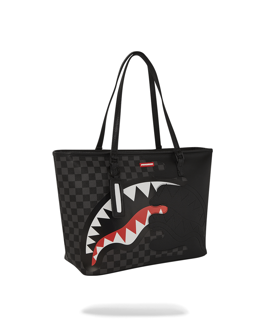 Model walking in NYC carrying printed tote on shoulder during fall commute