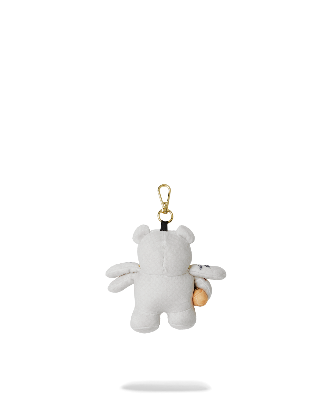 Cute teddy bear plush keychain with space-inspired design on a set of keys