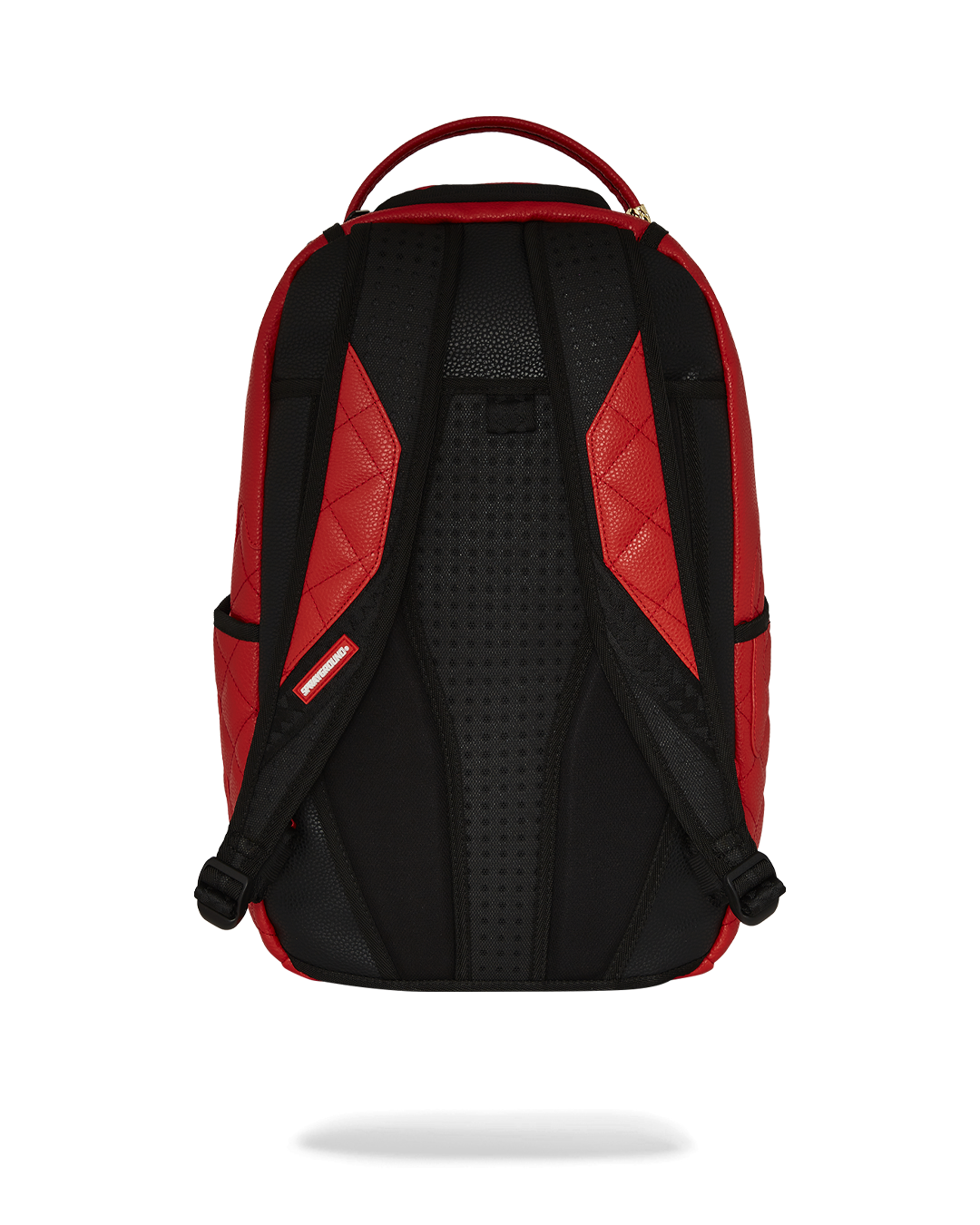 Front view of the embossed faux leather backpack with gold zippers shown against a city backdrop.
