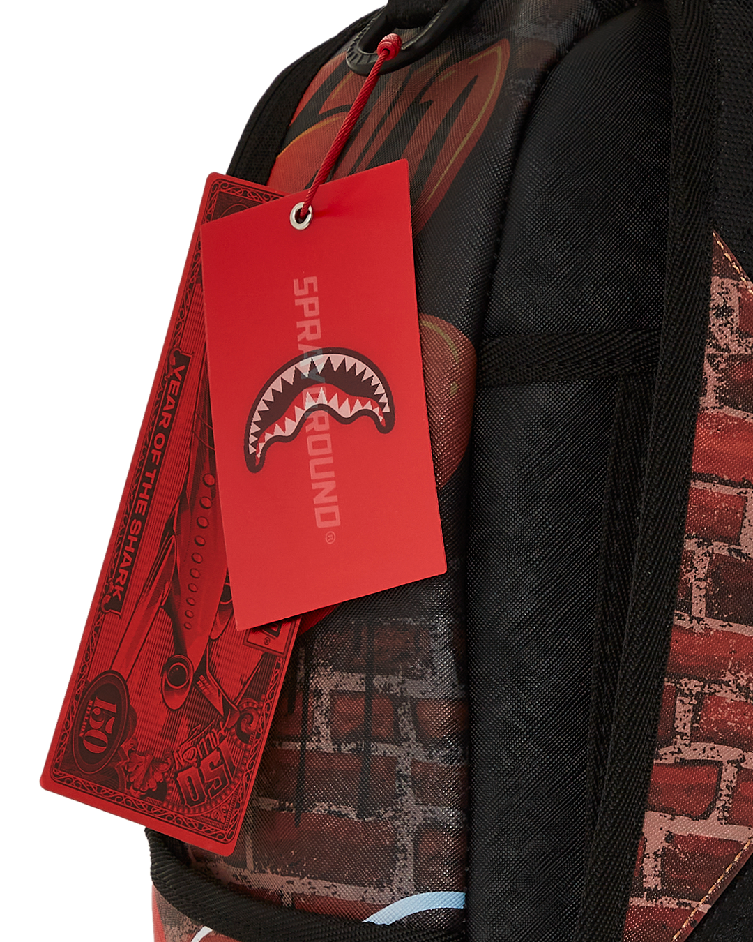 Side view of faux leather mini backpack with Gerald print and gold zippers
