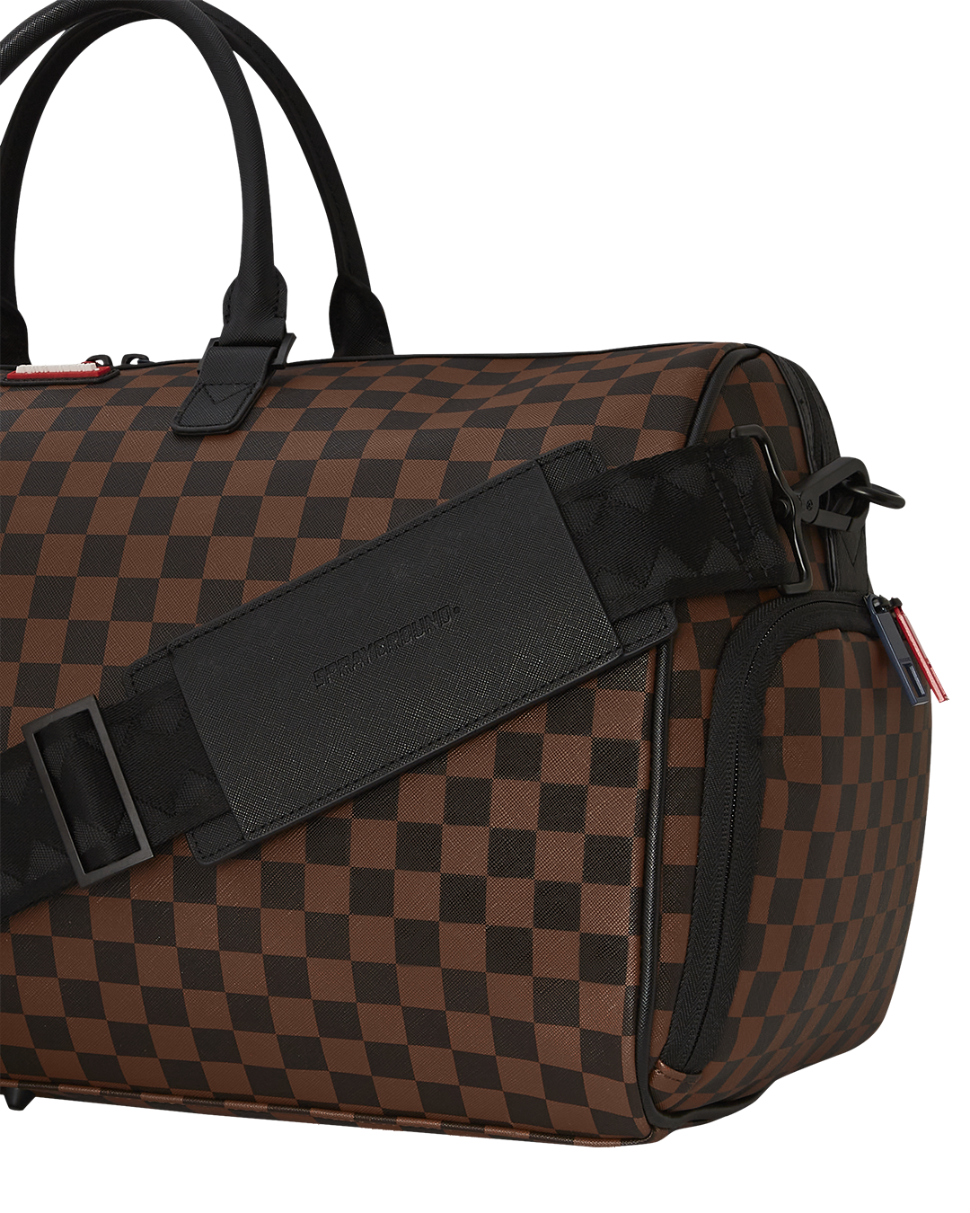 Close-up of the metal zipper pocket on the faux leather duffle.