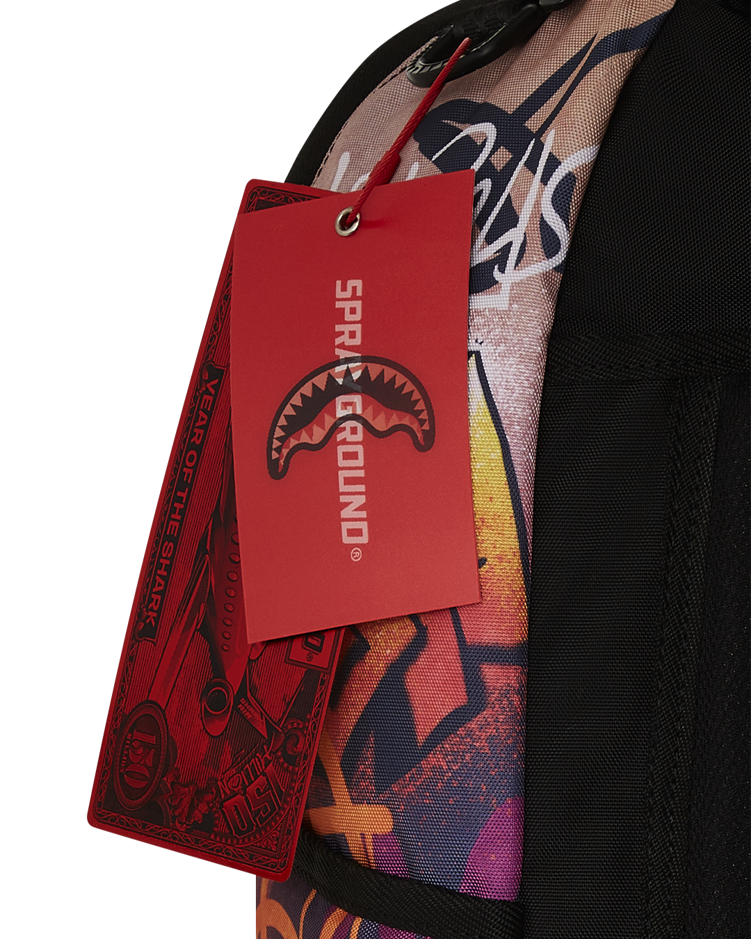 Close-up of the backpacks front zipper pocket with gold hardware