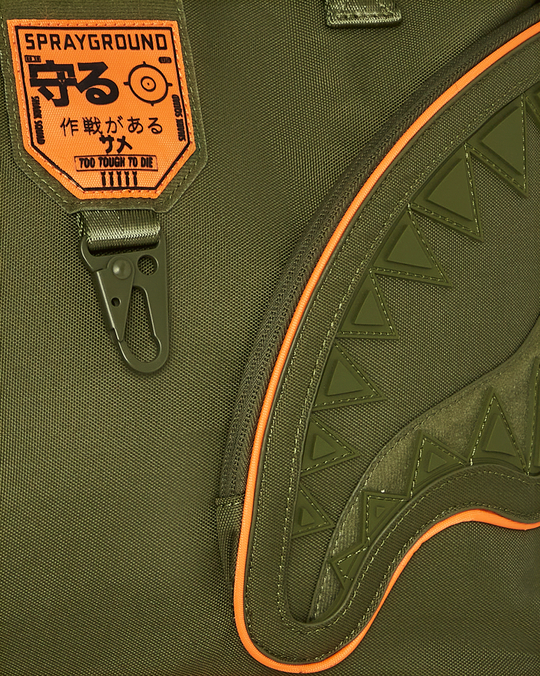Close-up detail shot of shark print and metal hardware on tote