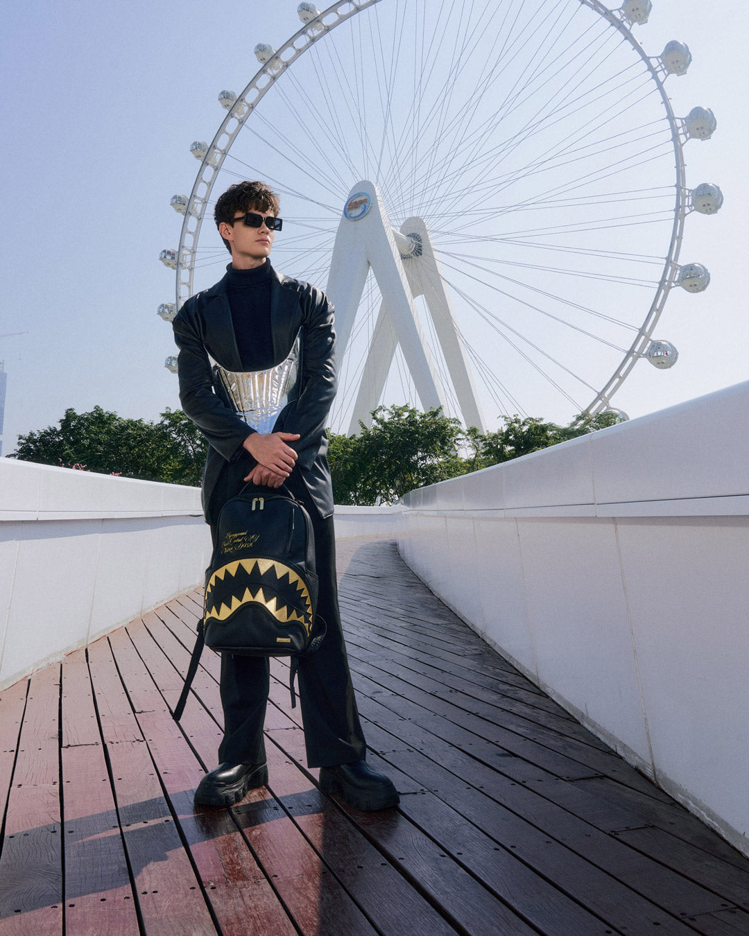 BAPE Shark backpack with faux leather finish and gold accents, front view