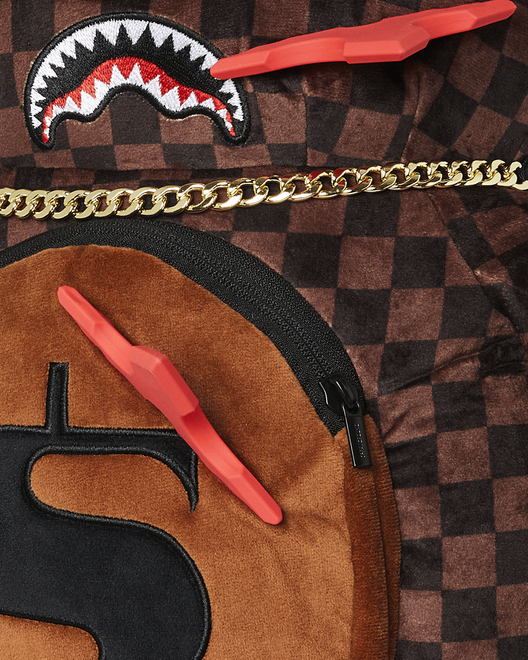 Interior view of the zippered pockets on the plush backpack for easy organization