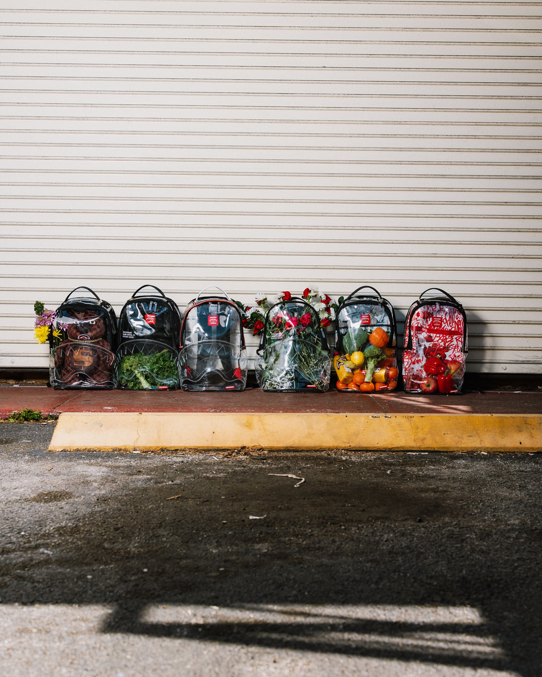 Transparent PVC Sprayground backpack with ergonomic mesh back padding, back view.