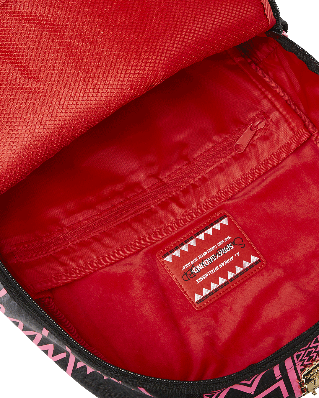Open interior of the designer backpack highlighting the velour laptop compartment