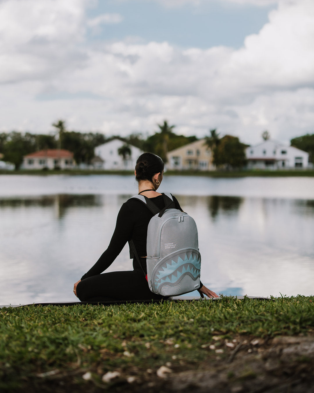 Front view of the stylish mesh backpack with reflective nylon accents and multiple compartments