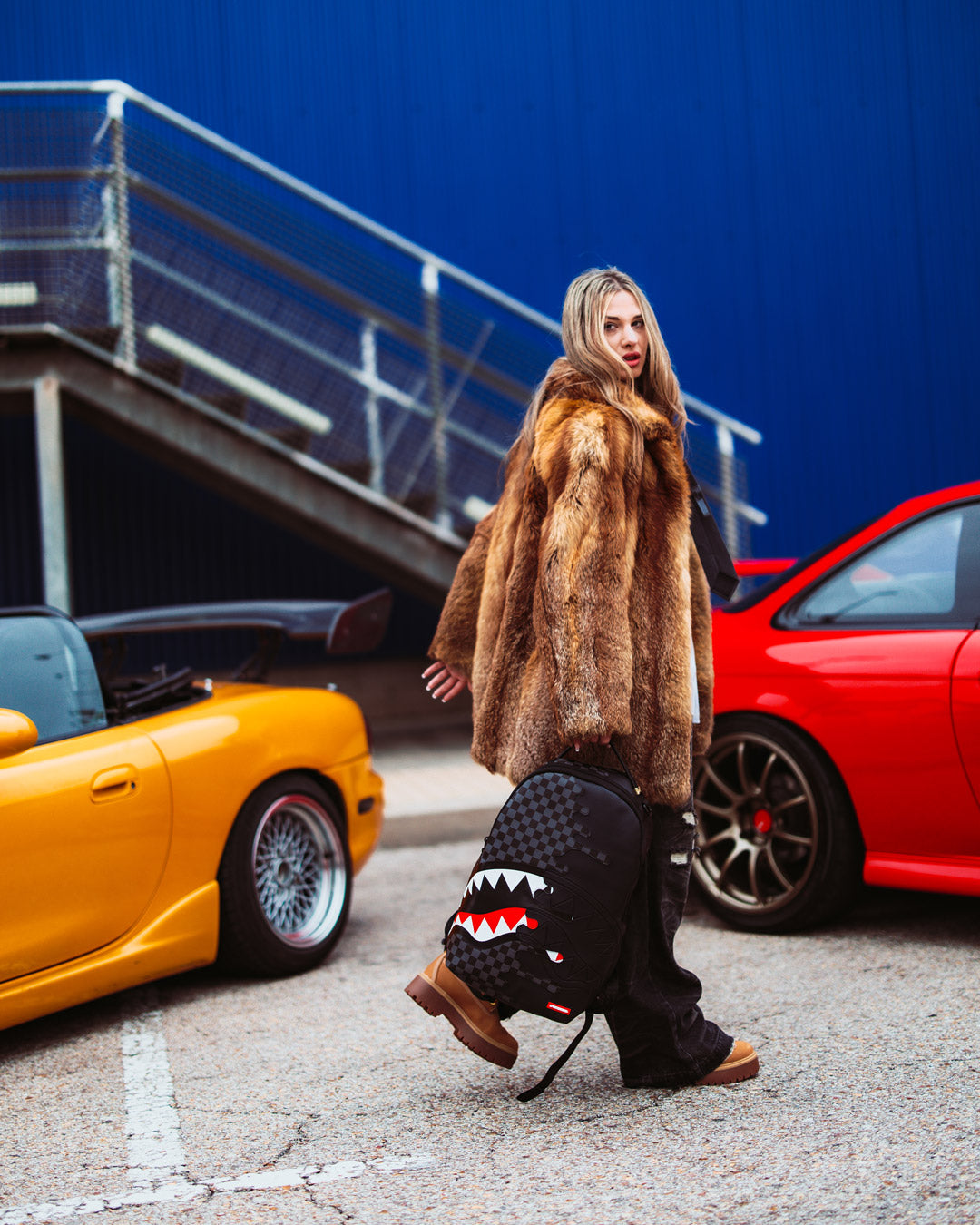 Speed Shark backpack open to showcase interior laptop and sunglass compartments