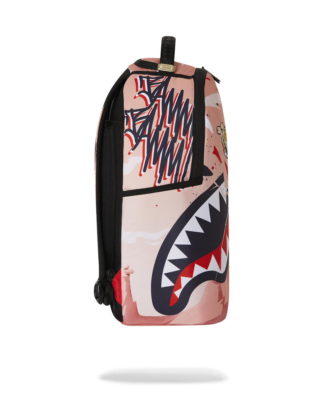 Close-up of the metal Sprayground Authentic badge on the Bamm Bamm Flintstones backpack
