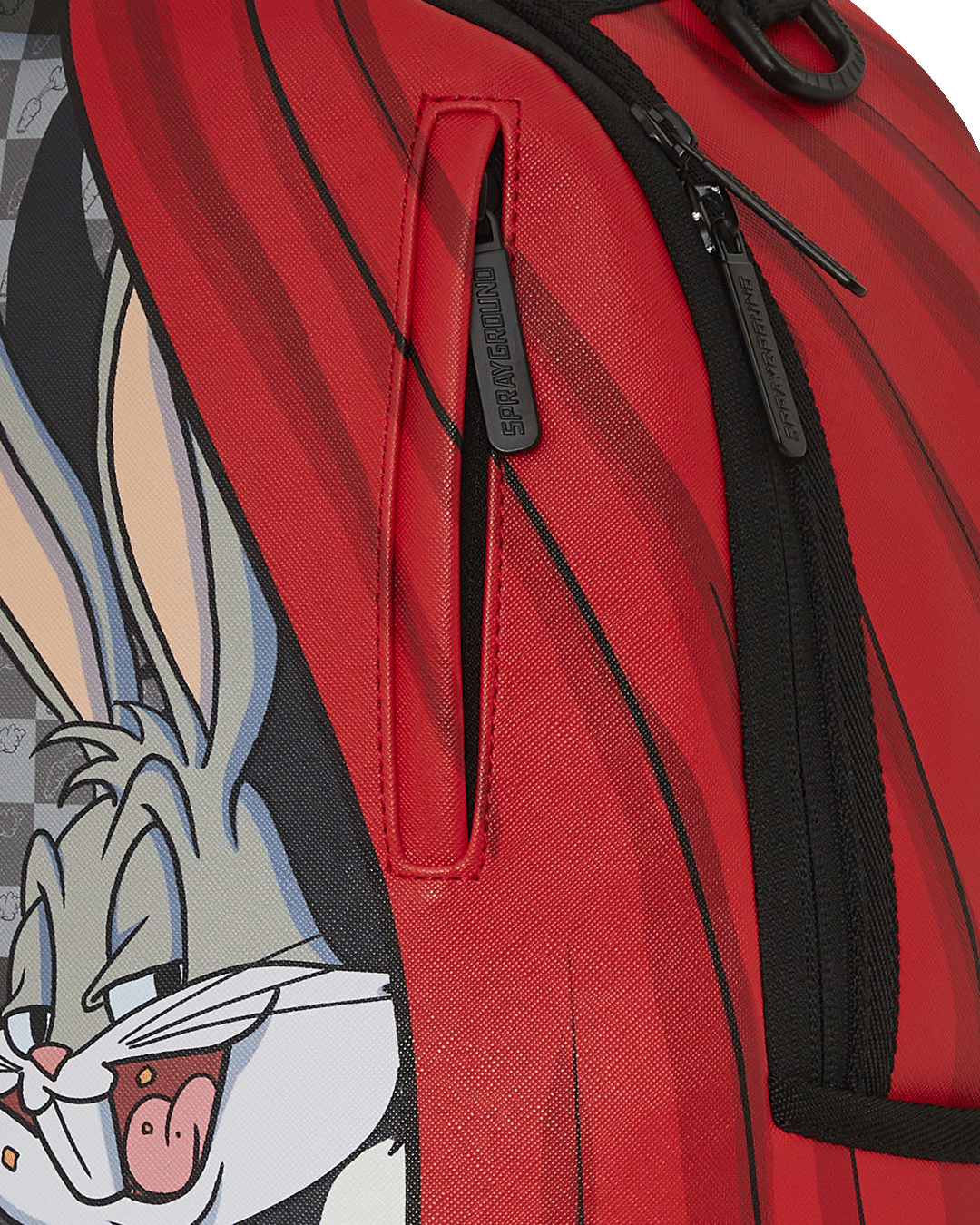 Interior view of the Bugs Bunny faux leather laptop backpack with velour compartments.