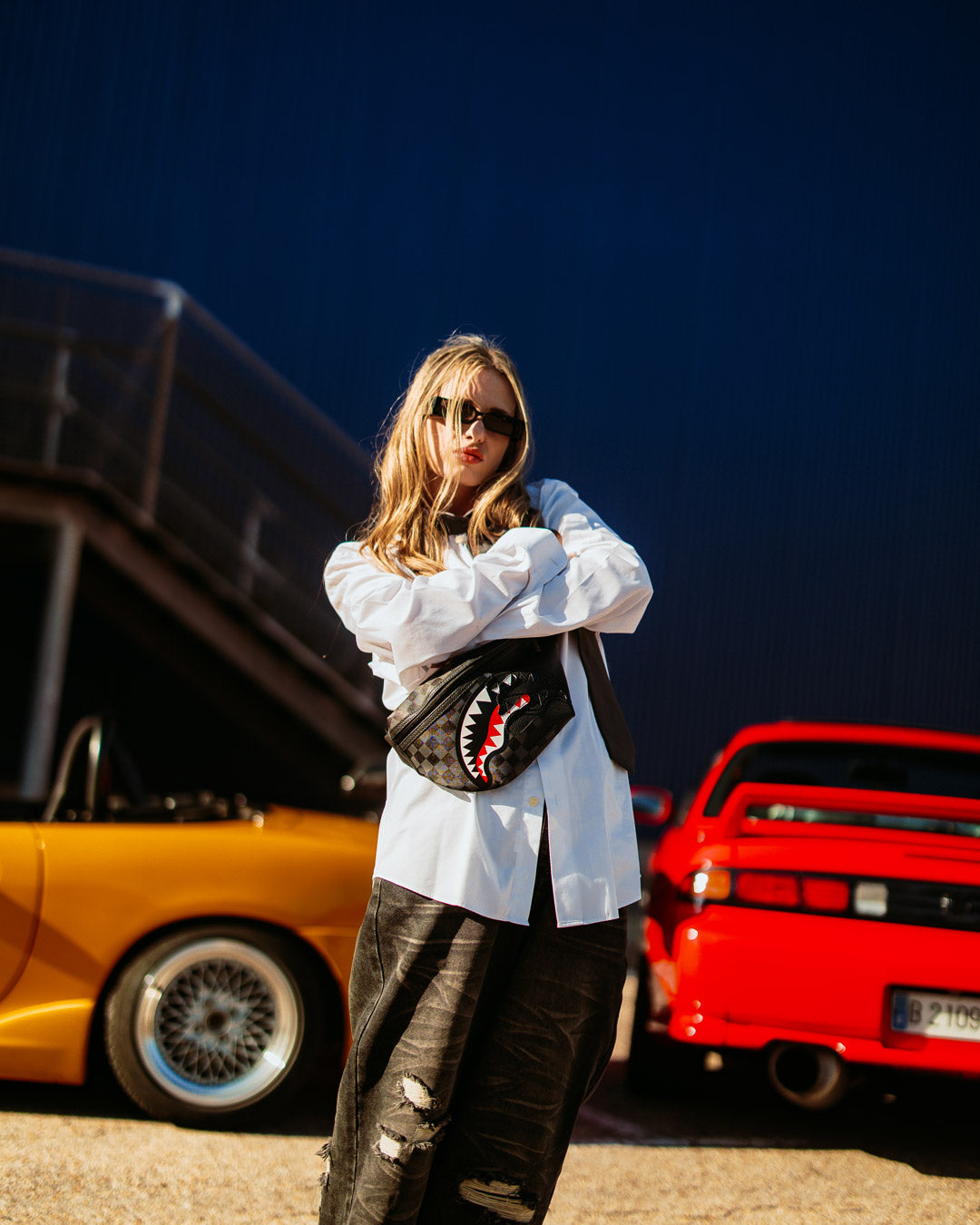 Model wearing the waist bag crossbody style for a casual urban look