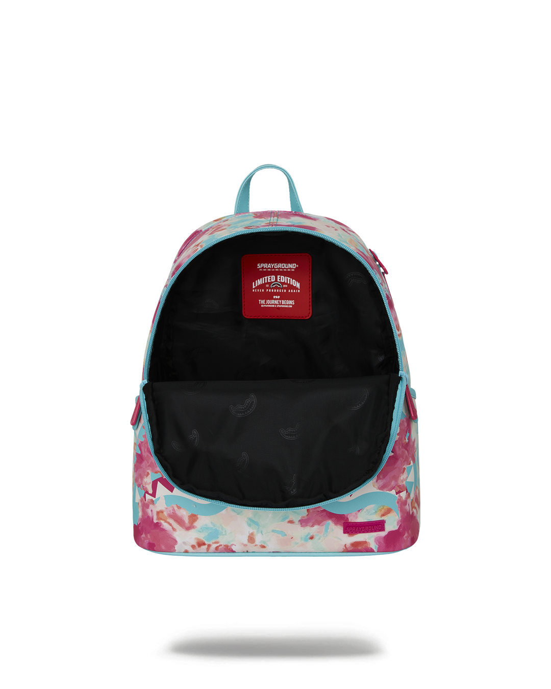 Model wearing backpack and travel-ready attire in an urban setting