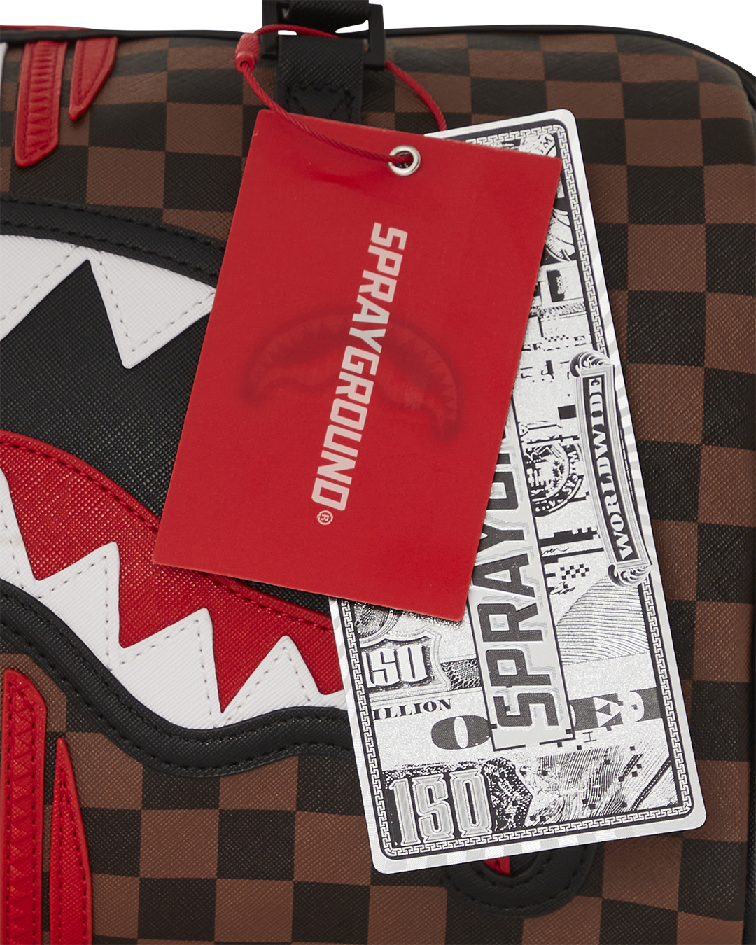 Close-up of the bags interior pockets and faux leather material.