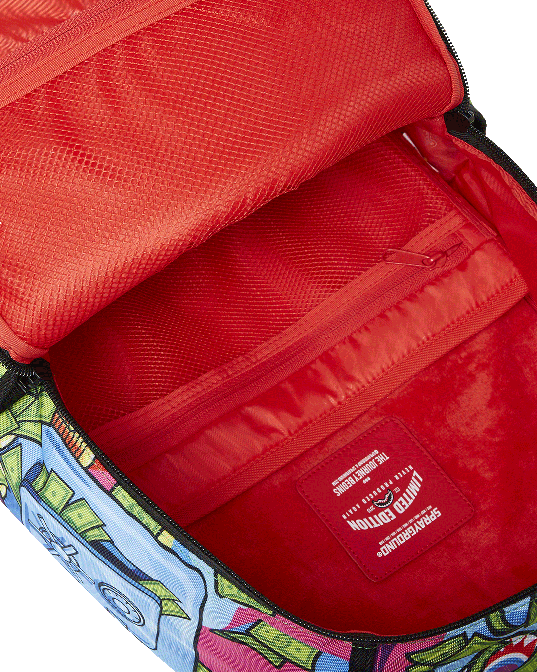 Close-up of velour compartments and metal Authentic badge on the luxury backpack exterior.