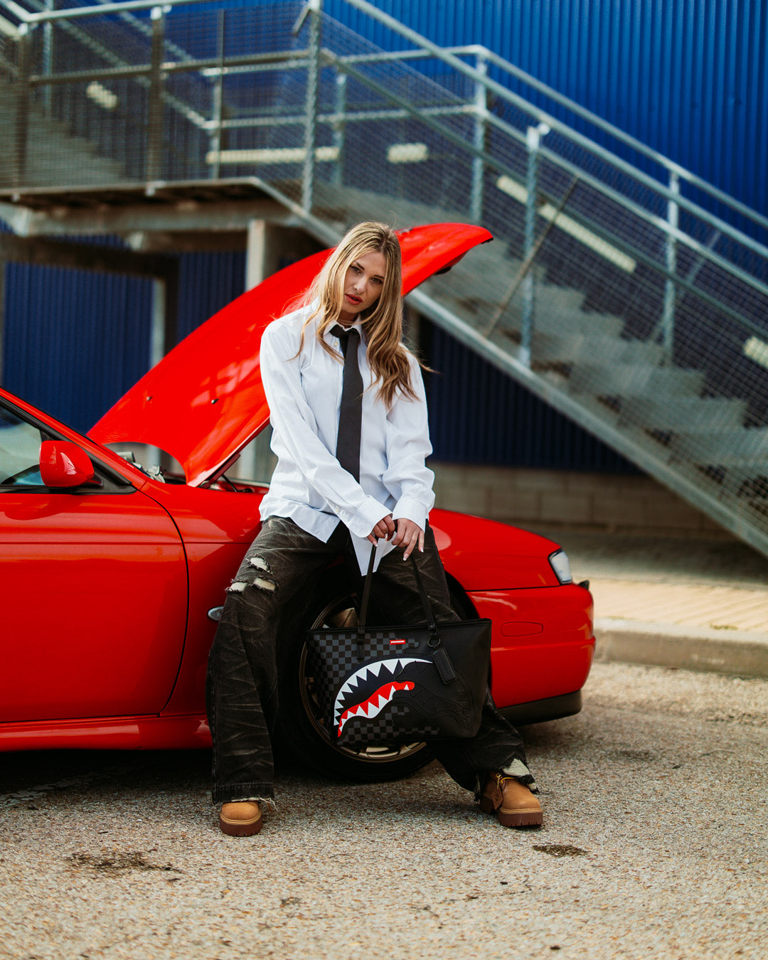 Front view of leopard print tote bag with shark graphic on faux leather