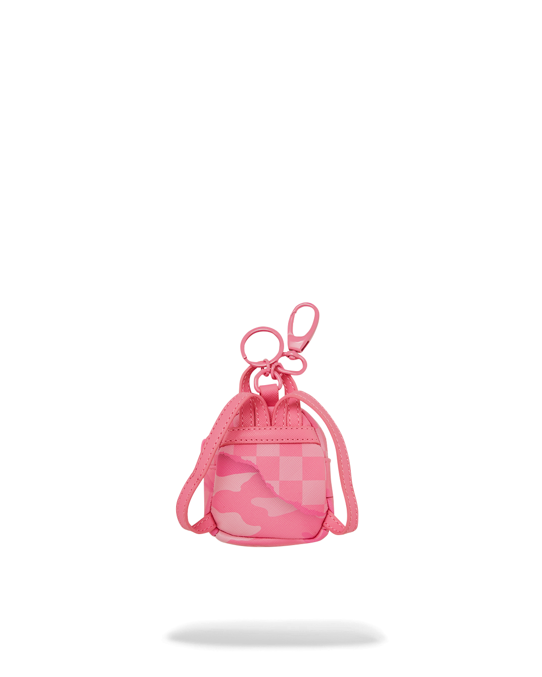 Front view of the 3AM TURNT keychain with small items inside